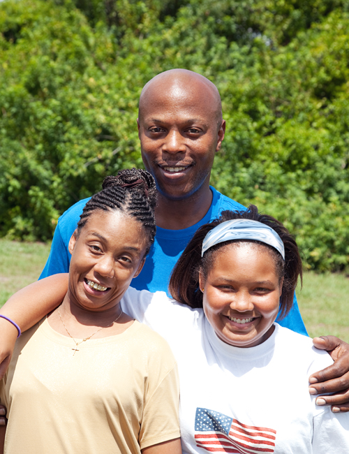 Father with daughters at event