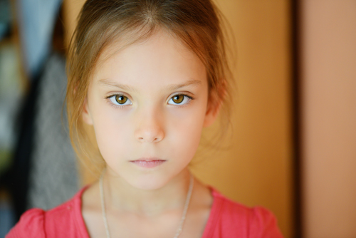 young girl with serious expression