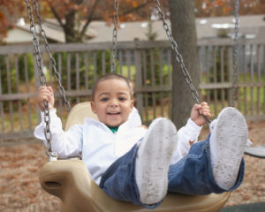 Young boy on swing