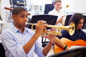 Teen playing trumpet