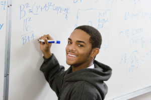Adult student at white board