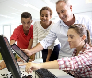 Teachers and Students working with computers