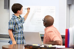 Student and teacher at whiteboard