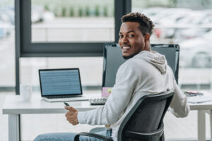 Male educator on laptop