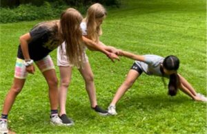 Three girls playing outside