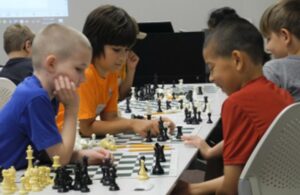 Elementary students playing chess