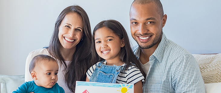 Parents with young daughter and baby
