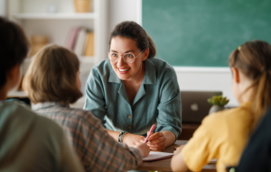 Smiling Teacher helping students