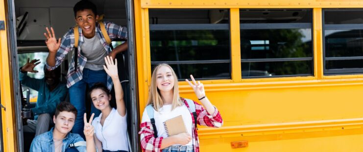 Students next to schoolbus.