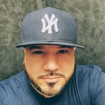 Young man wearing a New York Yankees hat