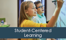 "Student-Centered Learning" overlaid on photo of two students writing on a smartboard