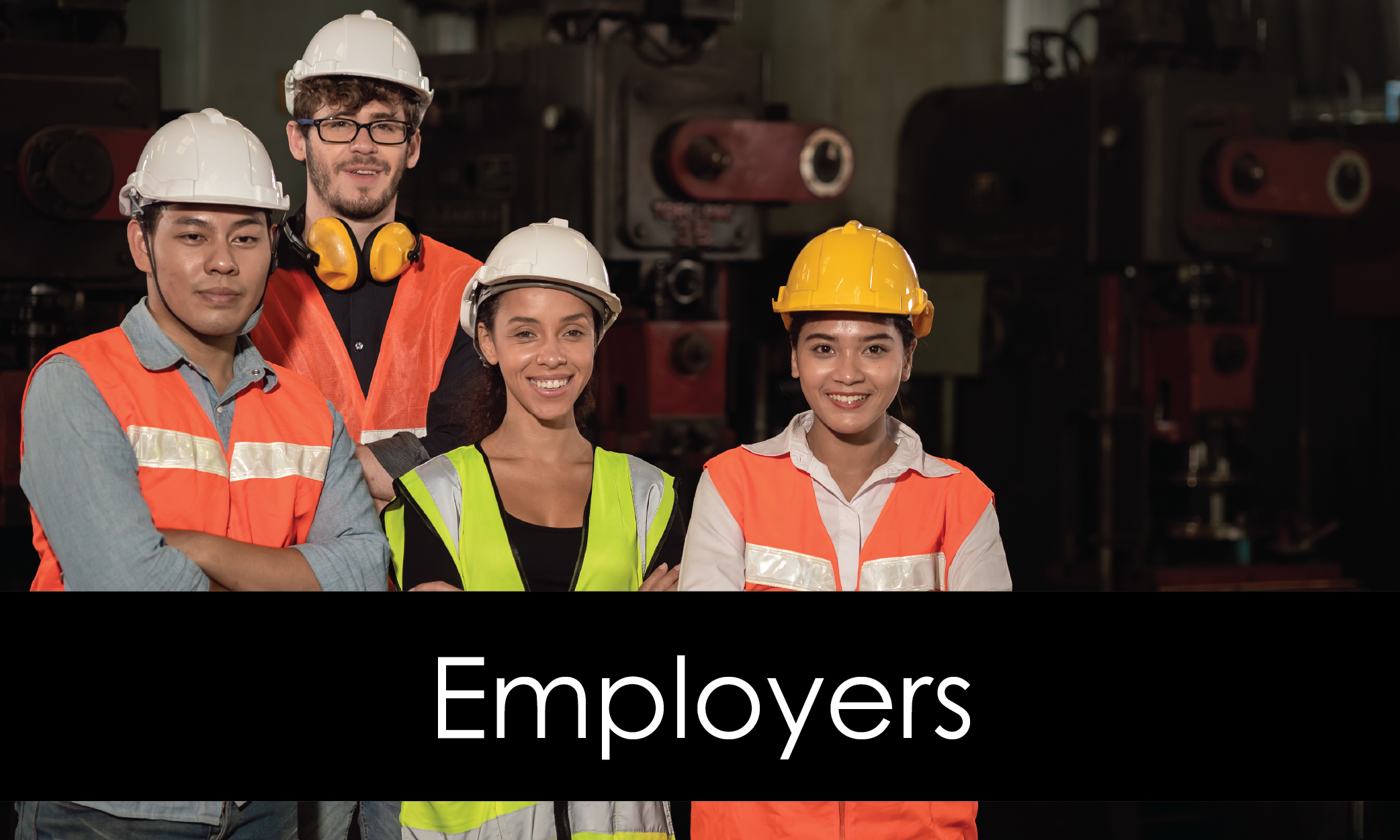 Group of smiling construction workers in a heavy industrial setting